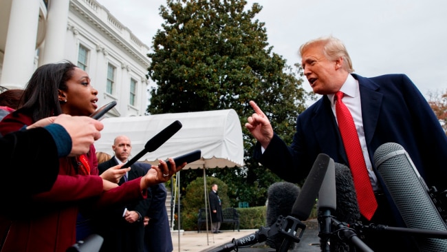 Former President Donald Trump during his time in office being bombarded by press at the White House. Picture: Getty Images