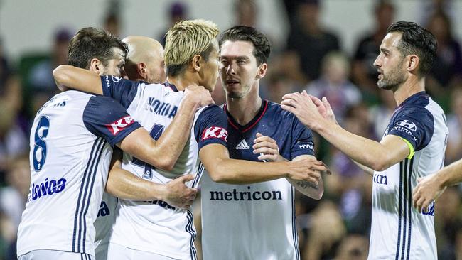 Keisuke Honda of the Victory (second left) celebrates a goal with teammates. Picture: AAP Image/Tony McDonough