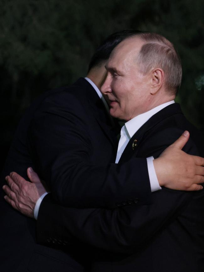 Russia's President Vladimir Putin and China's President Xi Jinping embrace each other after their talks in Beijing. Picture: AFP