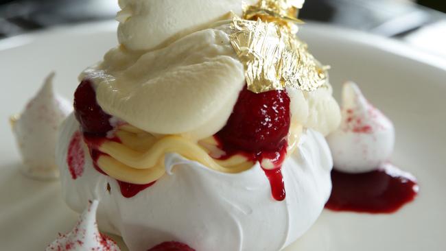 The Manly pav, served with a Moet cream, raspberries, passionfruit curd and a little bling.