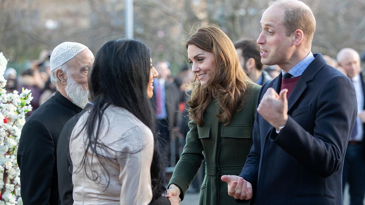 Prince William, Duke of Cambridge and Britain's Catherine, Duchess of Cambridge react during their visit to the Khidmat Centre in Bradford. Picture: Charlotte Graham / AFP