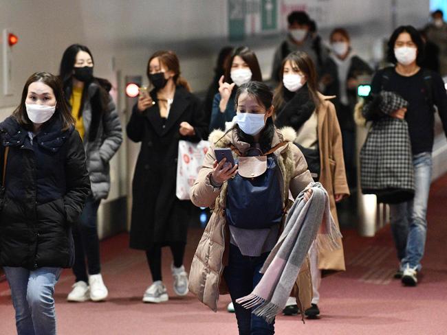 Passengers from overseas arrive at Tokyo's Haneda International Airport passenger terminal. Picture: AFP