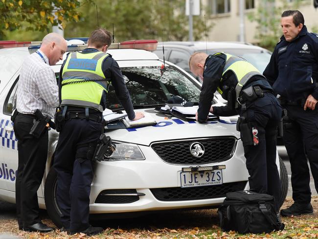 Police at the scene in South Yarra. Picture: Lawrence Pinder