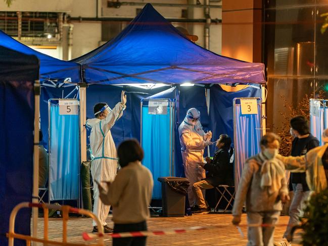 Hong Kong residents get tested for Covid in makeshift stations amid Omicron wave. Picture: Getty Images.