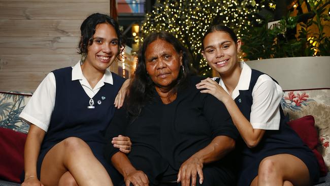 The unique NSW police scholarship has seen its first Indigenous graduate, Natayleah Georgetown, left, pictured with her grandmother, Patricia Georgetown, and sister Cyndell McDonald Georgetown, right. Picture: Richard Dobson