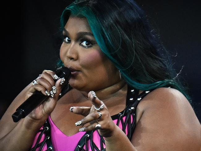 (FILES) US singer Lizzo performs on The Pyramid Stage on day 4 of the Glastonbury festival in the village of Pilton in Somerset, southwest England, on June 24, 2023. US performer Lizzo has been sued by three of her former dancers who allege the body-positive pop diva created a hostile work environment, court filings seen by AFP showed August 2nd. The suit filed in Los Angeles accuses Lizzo, whose self-love message has resonated around the globe, as well as other defendants of various violations of California labor law. (Photo by Oli SCARFF / AFP)