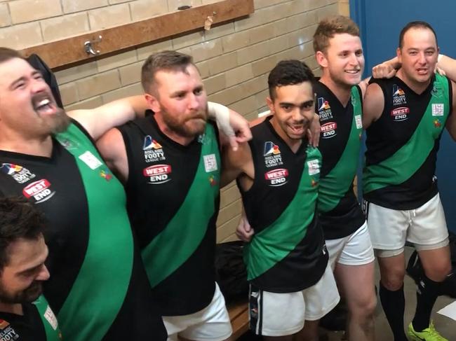 Greenacres players sing the song after a drought-breaking victory in the Adelaide Footy League. Credit: Matt Osborn