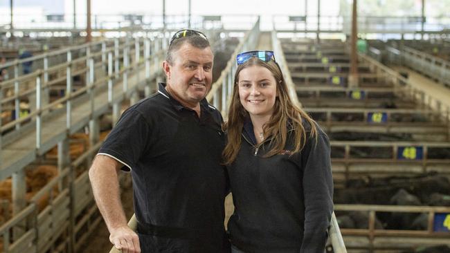 Warren Bailey and daughter Charlotte from Doreen, selling 17 Angus cattle.