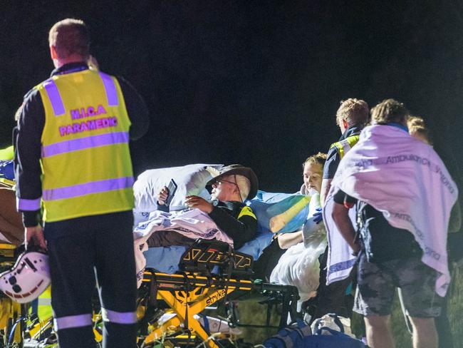 Sydney to Melbourne passenger train derailment in Wallan with two people confirmed dead. Emergency services treat injured passangers at a makeshift triage station at a BP petrol station on the Hume HWY. Picture: Jake Nowakowski