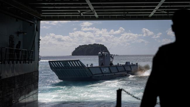 Members of the Australian Amphibious Force launch an LHD Landing Craft from the well deck of HMAS Adelaide during Wet and Dry Environment Rehearsals at Cowley Beach Training Area. Picture: Corporal Michael Rogers