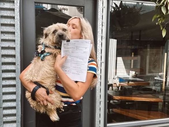 Hannah Wagner and her dog Daisy after signing the lease for Dark Blue on Fortitude Valley's Winn Lane.