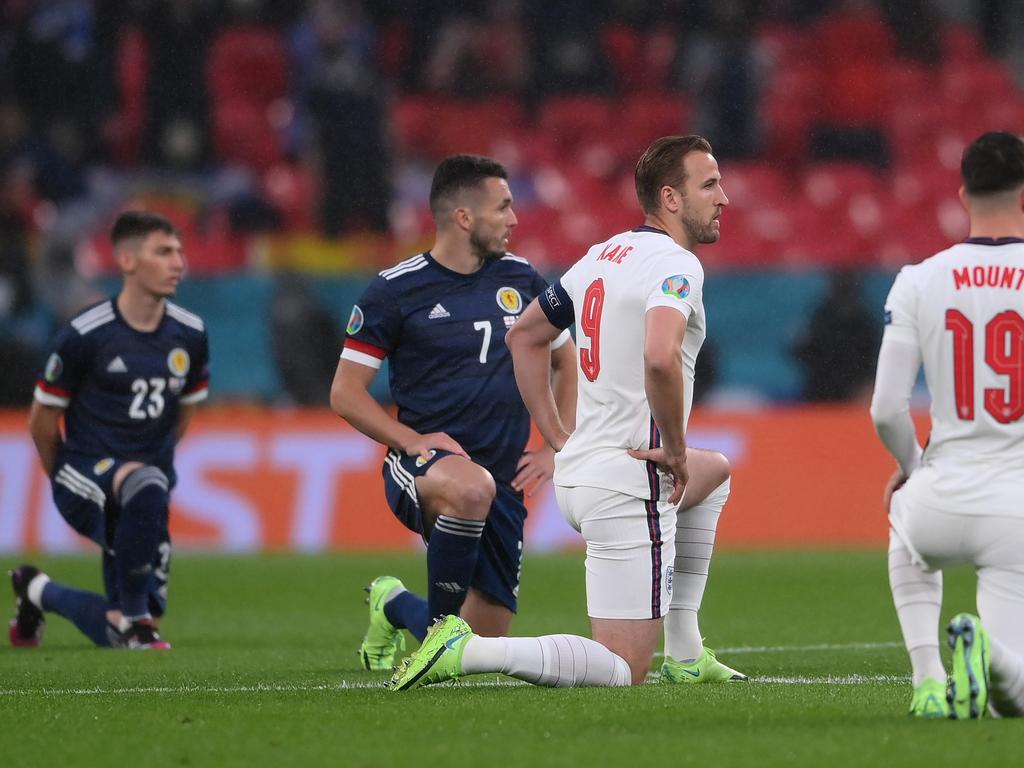 Harry Kane of England takes a knee in support of the Black Lives Matter movement.