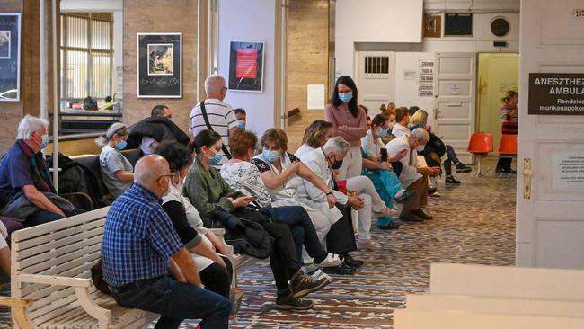 Health workers wait to get their dose of the Pfizer-BioNTech vaccine in Budapest. Picture: AFP