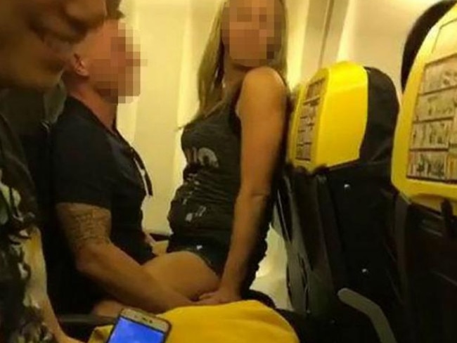 The two passengers get raunchy in full view of other passengers. Picture: SWNS/Mega