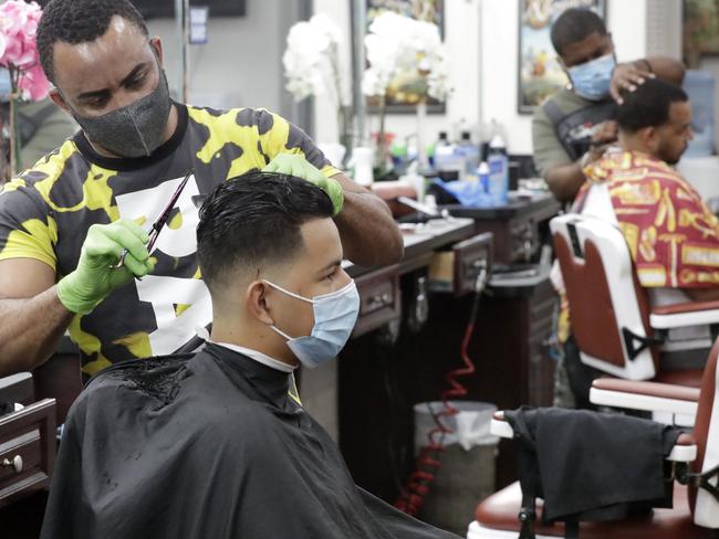 WHO officials have warned against easing coronavirus restrictions and reopening economies too fast. Personal grooming shops reopened in Cuba. Picture: AP Photo