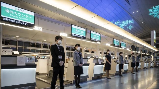 Empty check-in desks at Haneda airport in Tokyo.