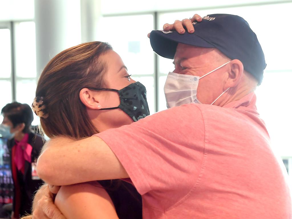 Rebecca Underhill hugs her father Paul Gimpel after arriving in Brisbane from Sydney. Picture: John Gass/NCA NewsWire