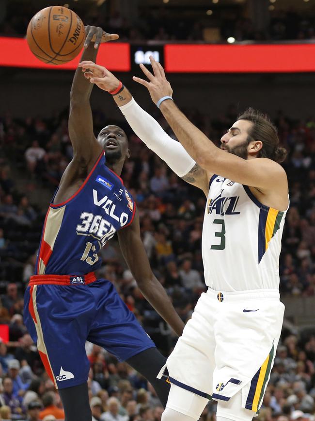 Adelaide 36ers forward Majok Deng blocks the shot of Utah Jazz guard Ricky Rubio in Salt Lake City. Picture: AP Photo/Rick Bowmer