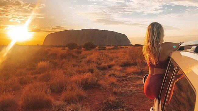 Tegan admires Uluru.