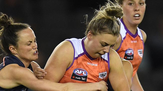 Ebony Marinoff is tackled during the AFL Women’s State of Origin match. Picture: AAP Image/Julian Smith