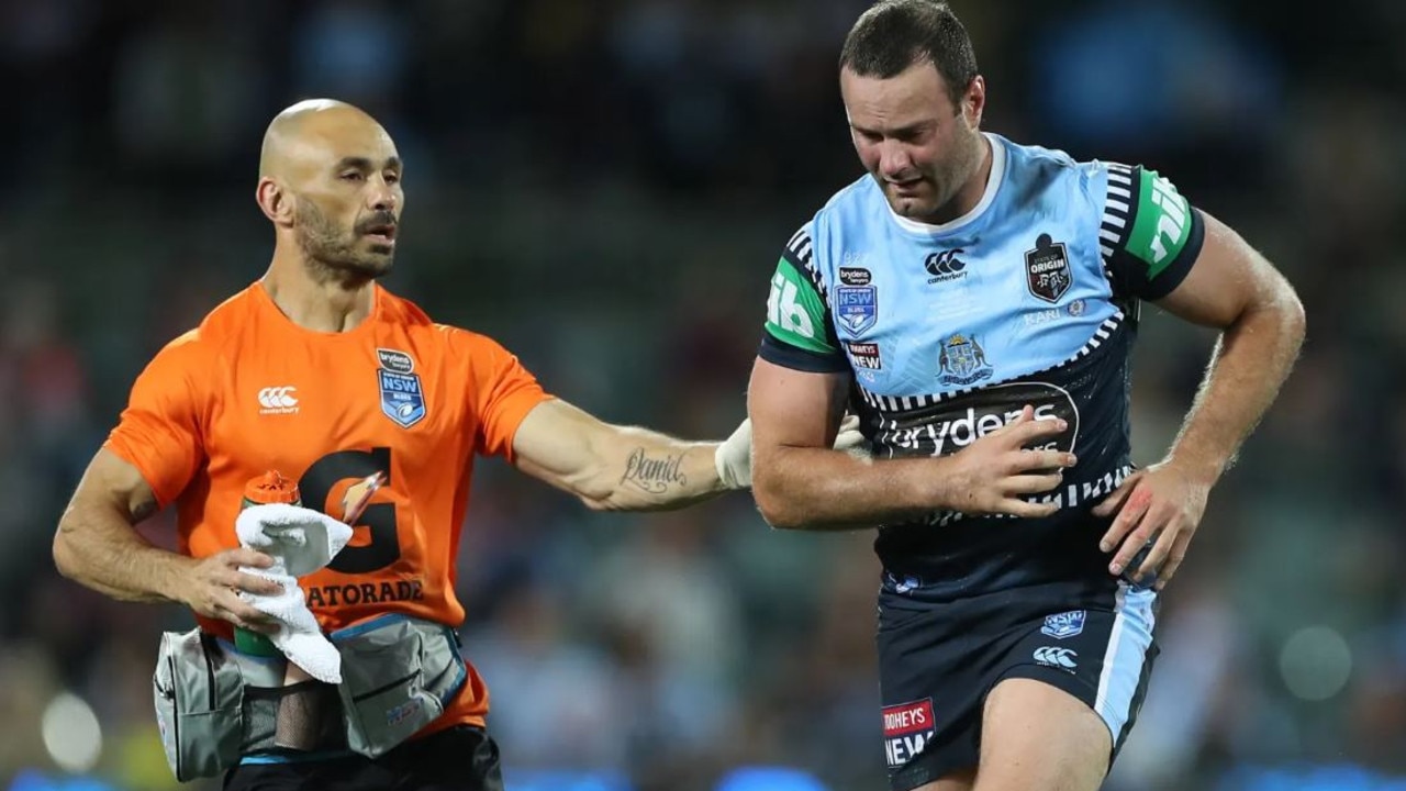 Boyd Cordner being assisted by Travis Touma. Picture: Getty Images