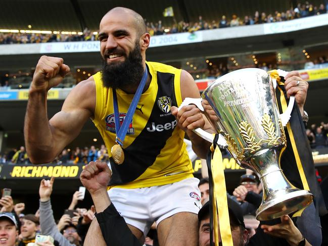 MELBOURNE, AUSTRALIA - SEPTEMBER 30:  Bachar Houli of the Tigers celebrates with fans after winning the 2017 AFL Grand Final match between the Adelaide Crows and the Richmond Tigers at Melbourne Cricket Ground on September 30, 2017 in Melbourne, Australia.  (Photo by Cameron Spencer/AFL Media/Getty Images)