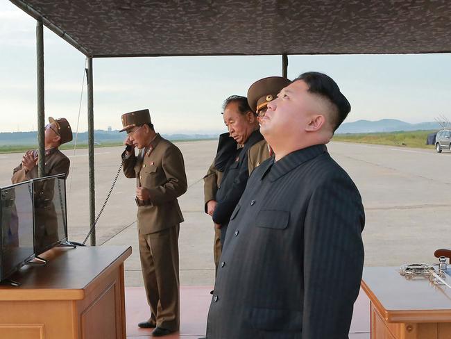 North Korean leader Kim Jong-un pictured at the launch drill of the medium-and-long range strategic ballistic rocket Hwasong-12. Picture: KNCA/AFP