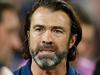 Cats coach cops big fine for on-field exchange