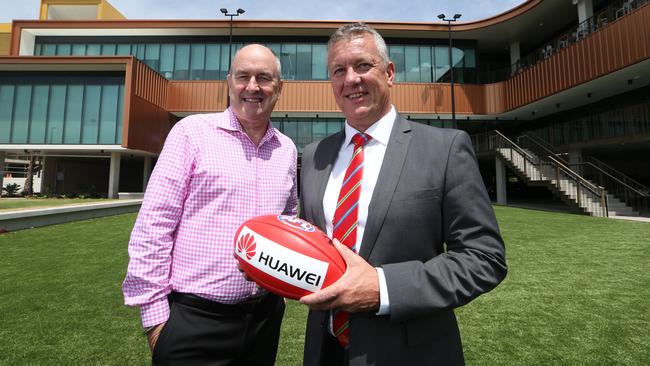 Cochrane (left) at Suns headquarters with club chief executive Mark Evans. Picture: Glenn Hampson