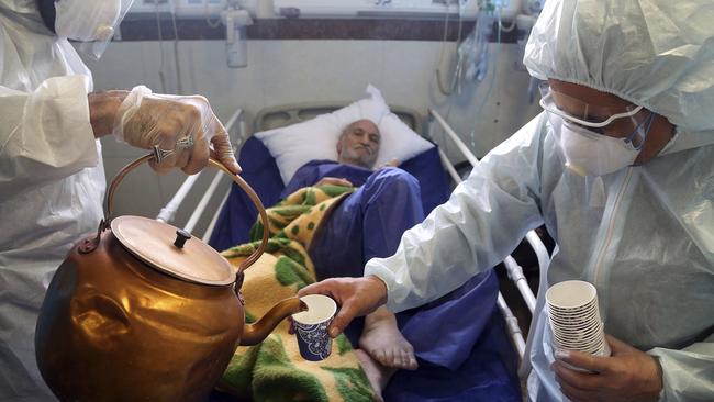 A man infected with coronavirus is treated at a hospital in Tehran, Iran. Picture: AP