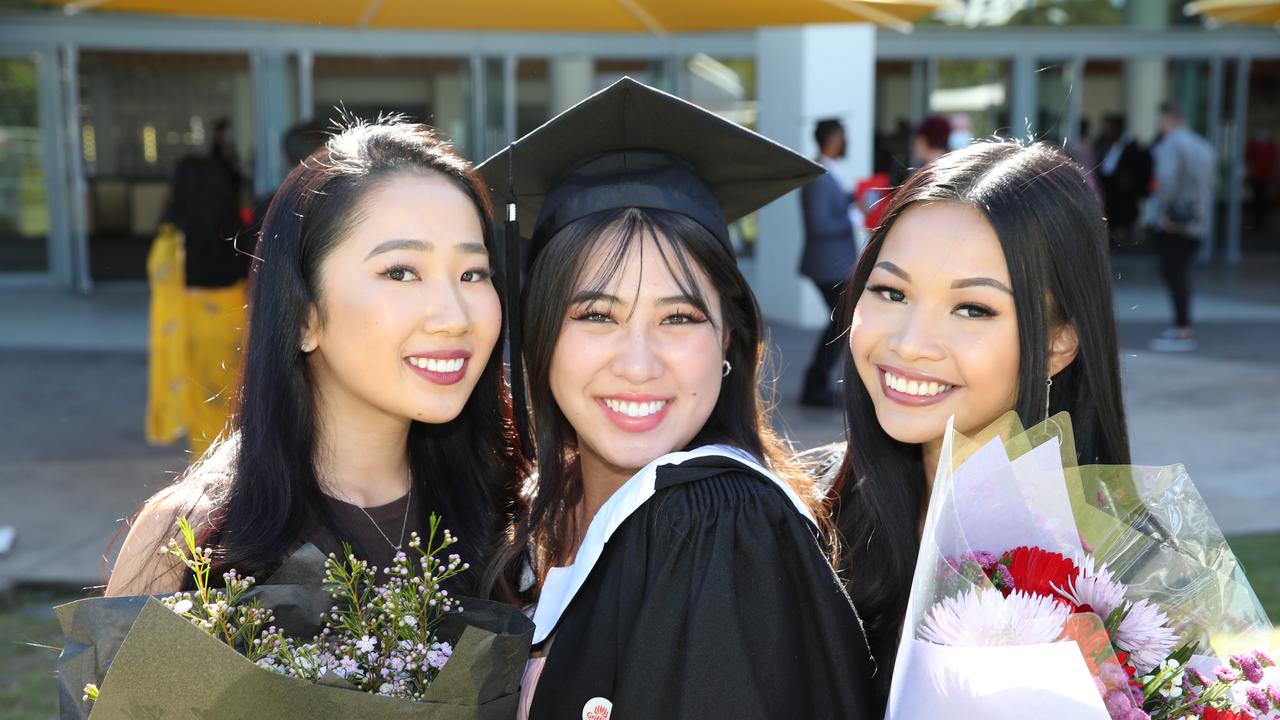 Griffith business school graduation at Gold Coast Convention Centre. Risa Kikuchihara, Yui Hashimoto, and Denise Taylor. Picture Glenn Hampson