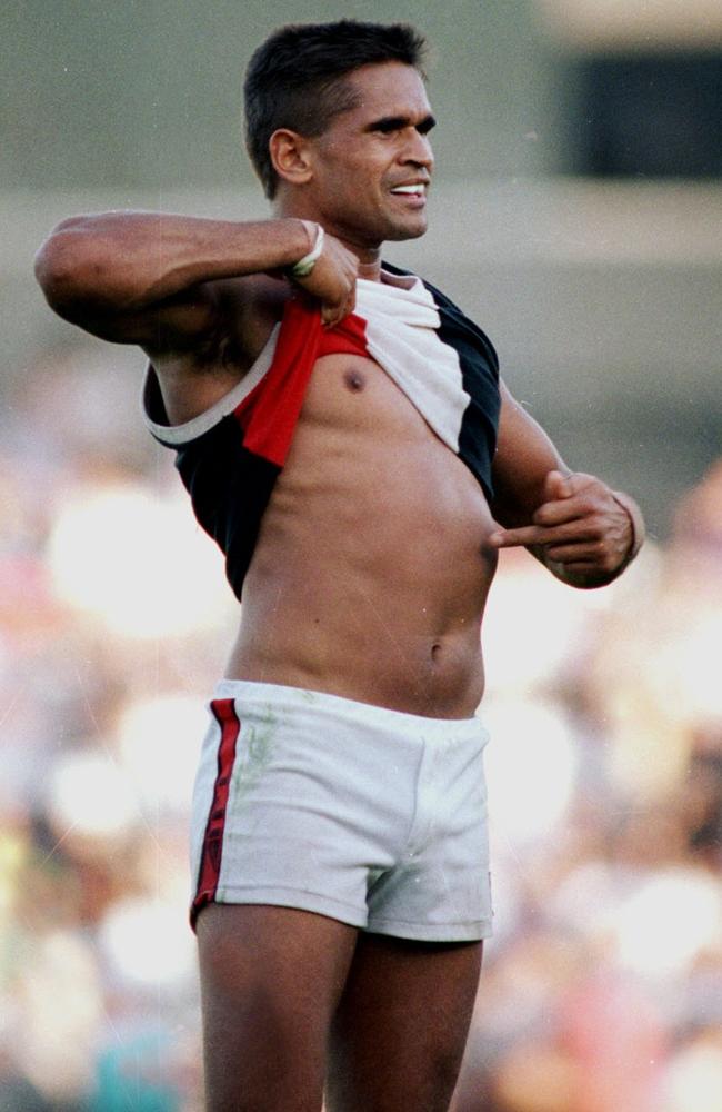 Nicky Winmar lifts his jumper and points to the colour of his skin to the Collingwood supporters at Victoria Park in 1993.