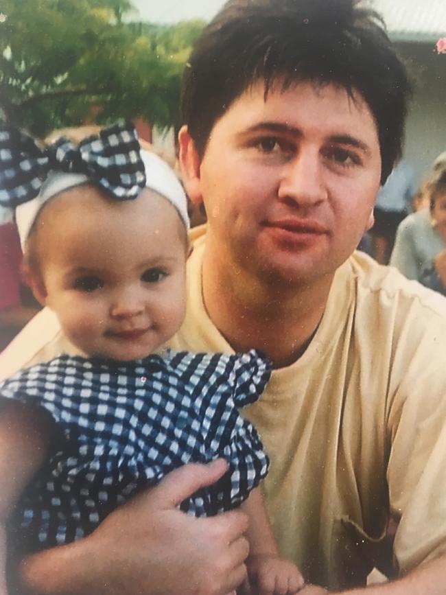 Rogers as a baby with dad Mark.