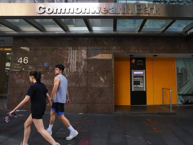 SYDNEY, AUSTRALIA - FEBRUARY 26: Pedestrians walk past a Commonwealth Bank of Australia (CBA) branch on February 26, 2024 in Sydney, Australia. Commonwealth Bank's latest financial results reveal a robust performance, with the bank reporting a record profit of $9.6 billion for the 2022-23 fiscal year, underscoring its position as Australia's largest and most profitable lender. The strong earnings were driven by solid loan growth, improved margins, and a focus on cost control, positioning the bank for continued success in a challenging economic environment. (Photo by Lisa Maree Williams/Getty Images)