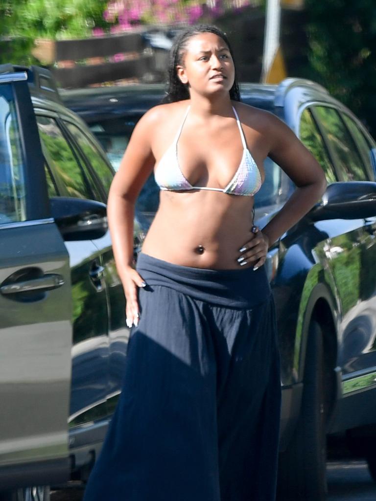 She had a bikini top and skirt on for the occasion. Picture: Splash News