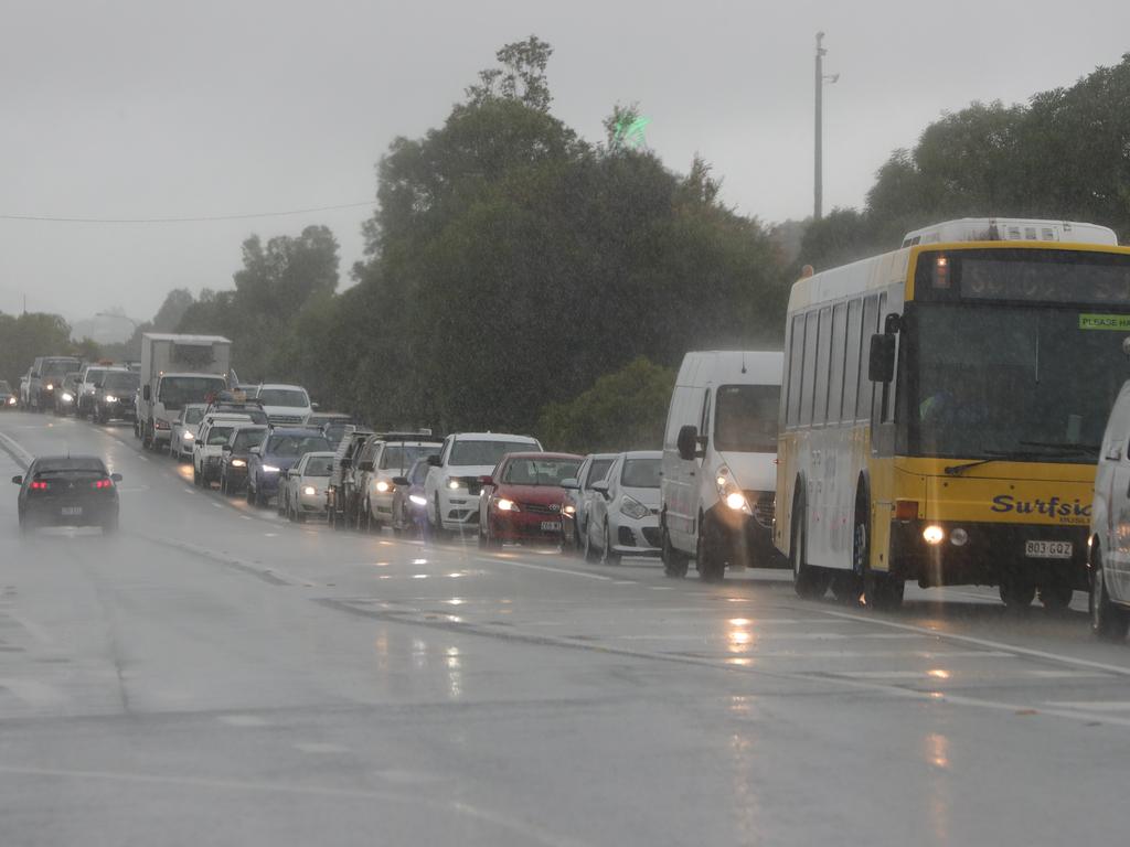 Traffic on Siganto Dve at Oxenford, Gold Coast, was closed due to floodwaters. But some didn’t see trouble coming … Picture: Glenn Hampson