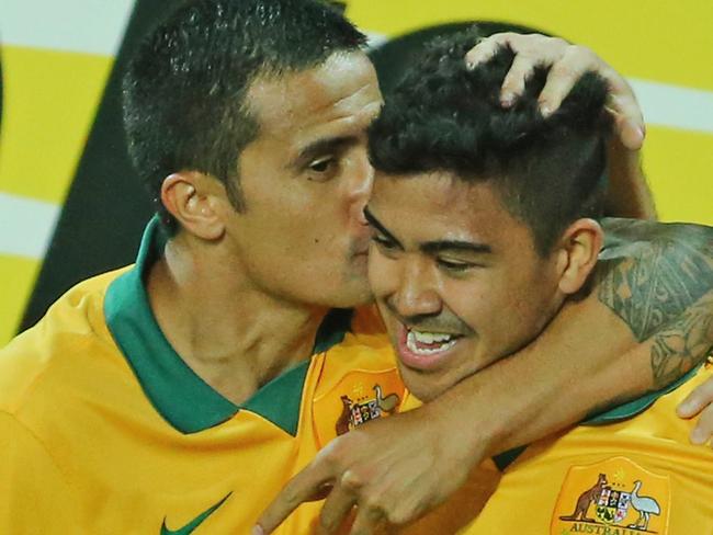 MELBOURNE, AUSTRALIA - JANUARY 09: Massimo Luongo of the Socceroos is congratulated by Tim Cahill and his teammates after scoring a goal during the 2015 Asian Cup match between the Australian Socceroos and Kuwait at AAMI Park on January 9, 2015 in Melbourne, Australia. (Photo by Scott Barbour/Getty Images)