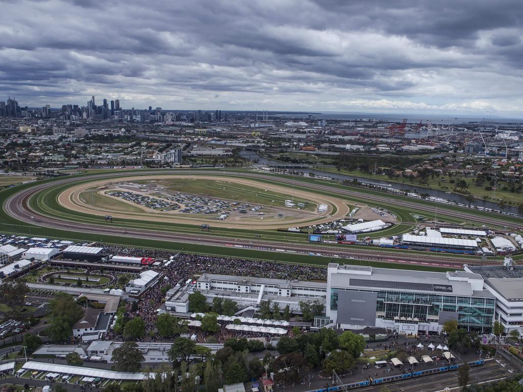 Flemington from the air as rain clouds roll over Melbourne. Picture: Sarah Matray