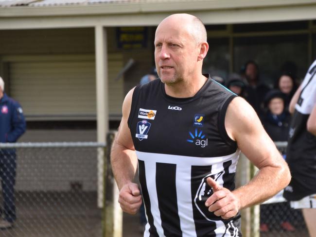 Steve Hamill runs out with Crib Point's reserves side.