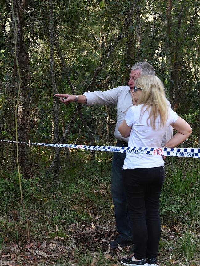 Mark and Faye Leveson stand amid the police tape in the Royal National Park yesterday. Picture: AAP