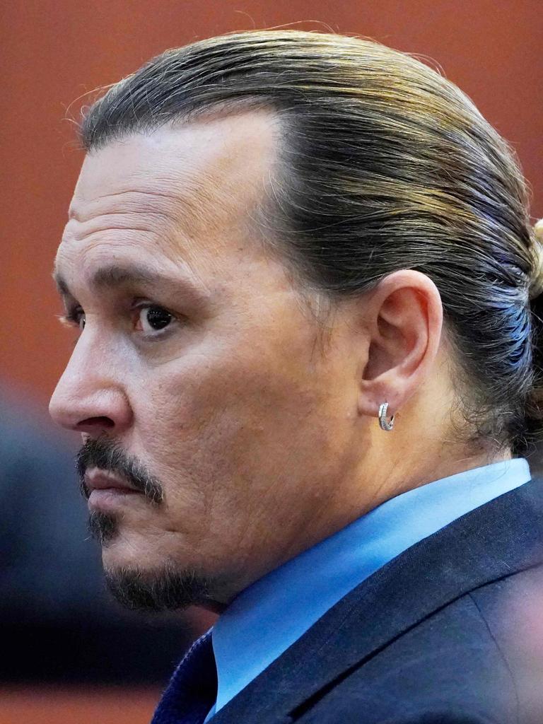 US actor Johnny Depp listens in the courtroom. (Photo by Steve Helber / POOL / AFP)