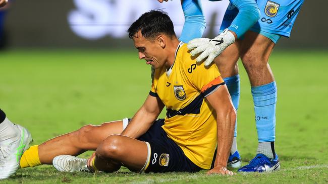 Trent Sainsbury holds his leg after suffering an injury against Macarthur. (Photo by Mark Evans/Getty Images)