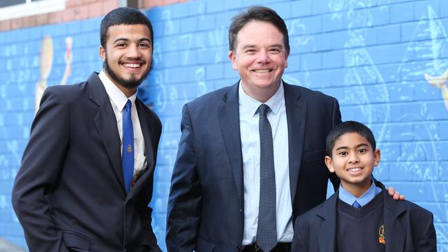 Principal Robert Patruno is all smiles alongside school captain Mohamed Shaar and student Amin Aggag. Picture: Richard Dobson