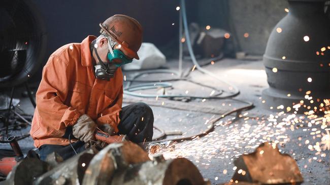 A worker welds metal at a factory in Hangzhou, in China's eastern Zhejiang province. Picture: AFP