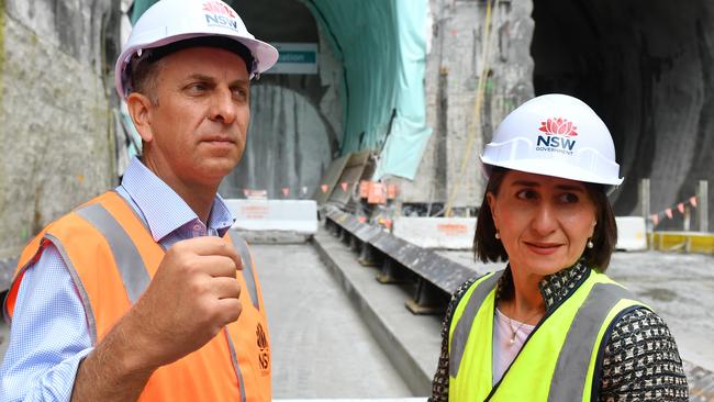 NSW Premier Gladys Berejiklian and Transport Minister Andrew Constance watch as a tunnel boring machine breaks through the Metro Rail Tunnel at Waterloo Station. Picture: AAP