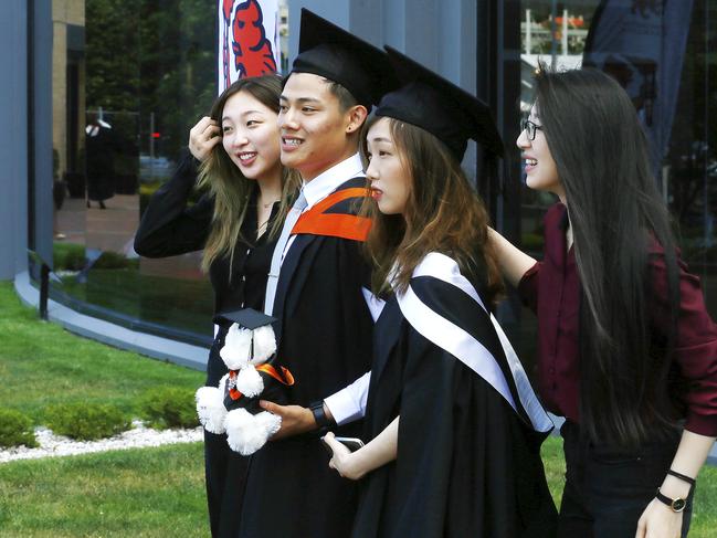 UTAS Graduations - Tasmanian School of Business and Economics and Graduate Research graduates are pictured before the ceremony. Picture: MATT THOMPSON