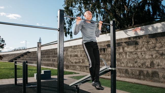 Former Tasmanian Premier Peter Gutwein has moved into an extensive fitness regimen after leaving politics. Seen here doing chin-ups at a Launceston exercise park. Picture: Melanie Kate/Men's Health magazine