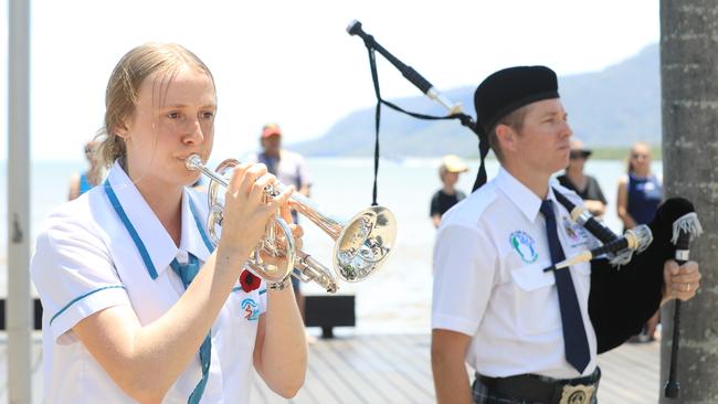 St Andrew's student Olivia Stein played the Last Post and bagpiper Nathan McKenzie played Flowers of the Forest as the wreaths are laid at the Cairns RSL's Remembrance Day service at the cenotaph on the Cairns Esplanade. Picture: Brendan Radke