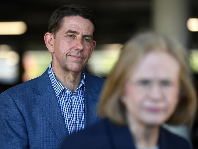 BRISBANE, AUSTRALIA - OCTOBER 16: Queensland Treasurer Cameron Dick (L) watches Chief Health officer Dr Jeannette Young during a press conference at a Bunnings hardware store on October 16, 2021 in Brisbane, Australia. The Queensland state government is hosting pop-up vaccination clinics at Bunnings stores around the state this weekend to increase access to the COVID-19 vaccine. (Photo by Dan Peled/Getty Images)