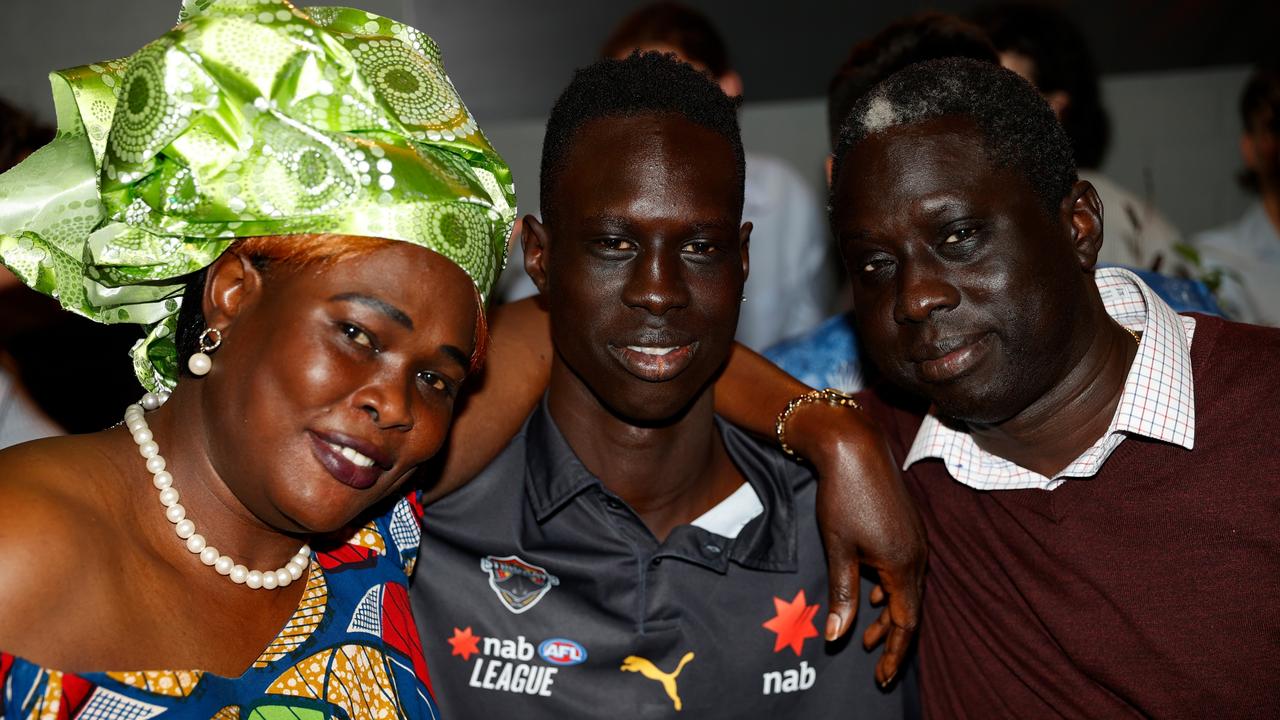 Mac Andrew with his parents Mary and Lual. Picture: Michael Willson/AFL Photos